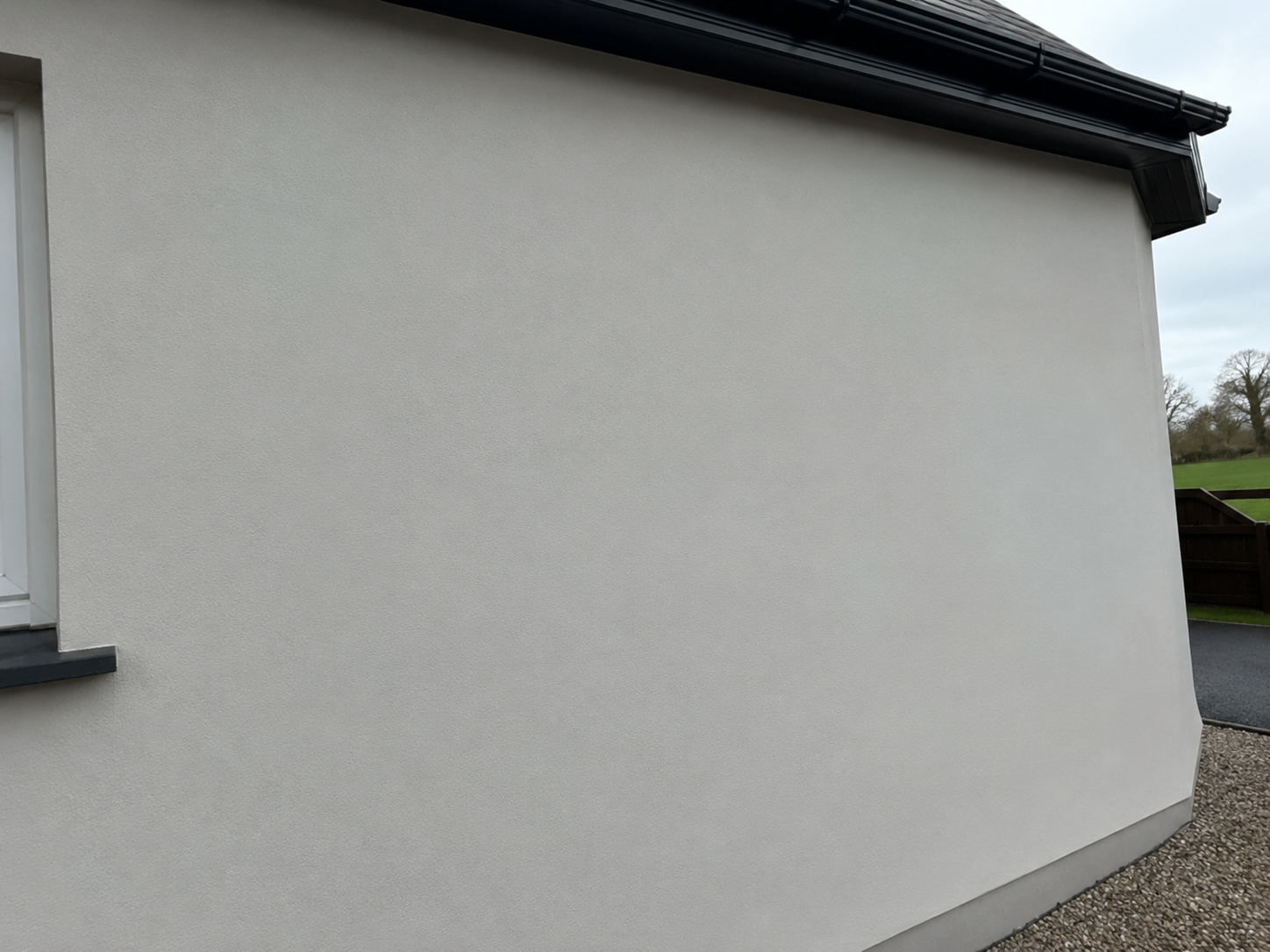 Clean render wall in County Wexford after red algae softwash treatment